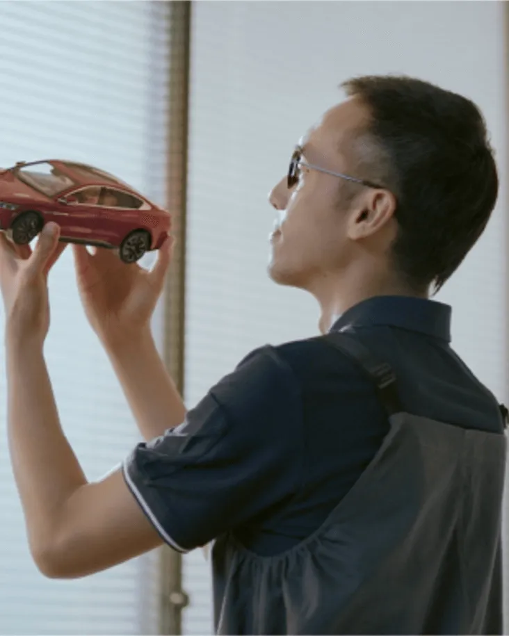 Automotive specialist reviewing a vehicle model